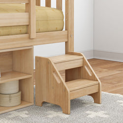 Wooden step stool for kids in a bedroom next to a yellow bed.
