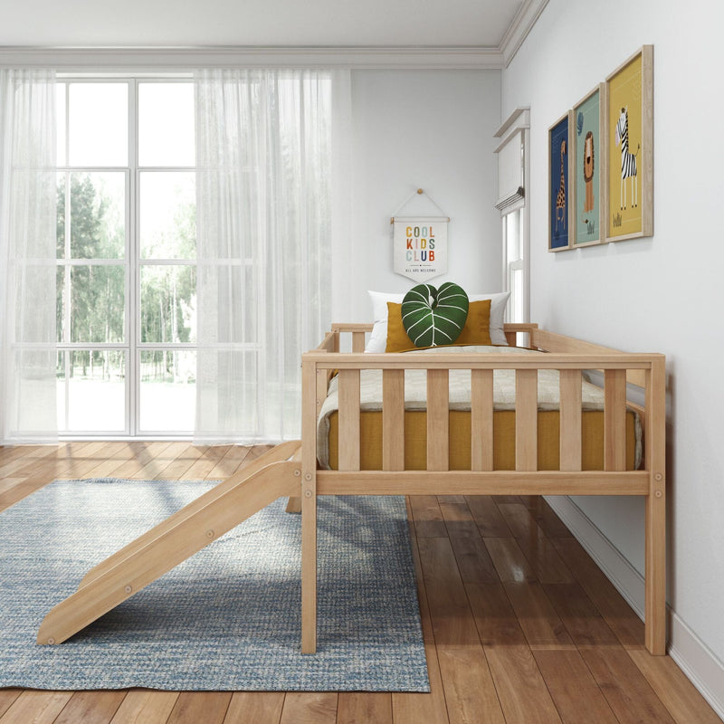 Modern Scandinavian kids bedroom featuring a wooden toddler bed with slide, mustard cushions and leaf pillow, framed animal nursery wall art, and a large window with sheer curtains letting in natural light