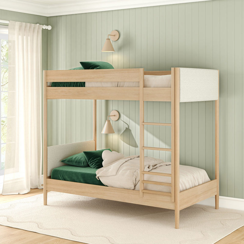Scandinavian-style kids bedroom with natural wood bunk bed, sage green vertical paneled wall, dark green velvet pillows, neutral bedding, beige wall sconces and sheer curtains