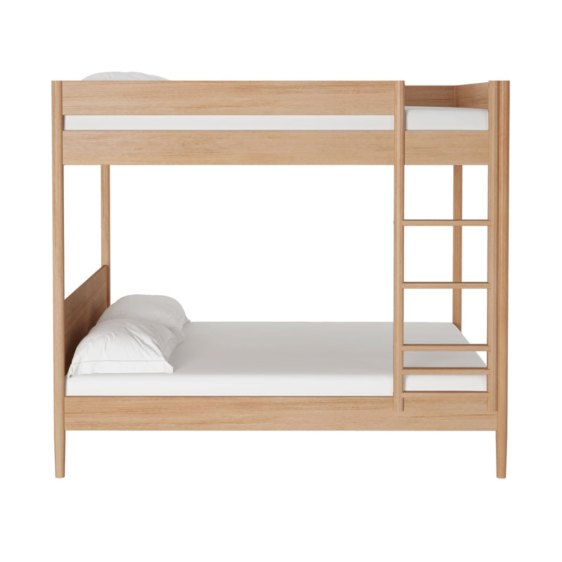 Natural oak twin-over-full wooden bunk bed with ladder, white mattresses and pillows and minimalist modern design