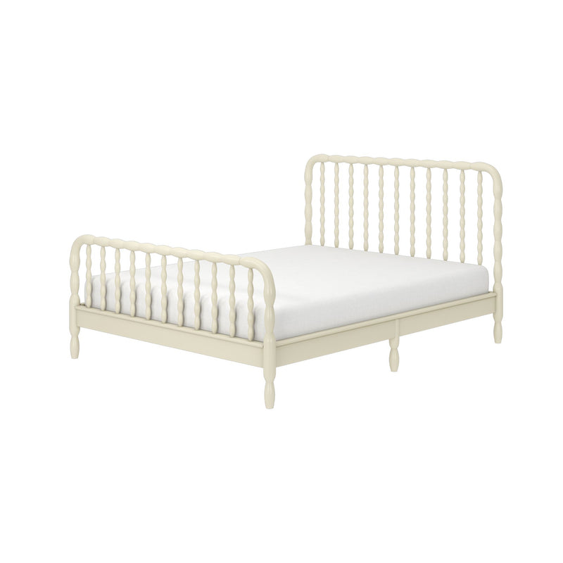 Ivory spindle bed frame with turned wooden headboard and footboard and white mattress, farmhouse-style bedroom furniture