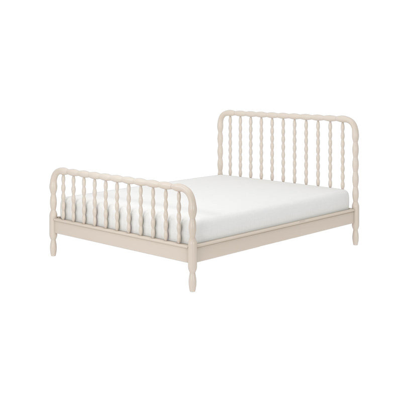 Beige spindle wooden bed frame with turned spindle headboard and footboard and white mattress, farmhouse-style platform bed on a clean white background