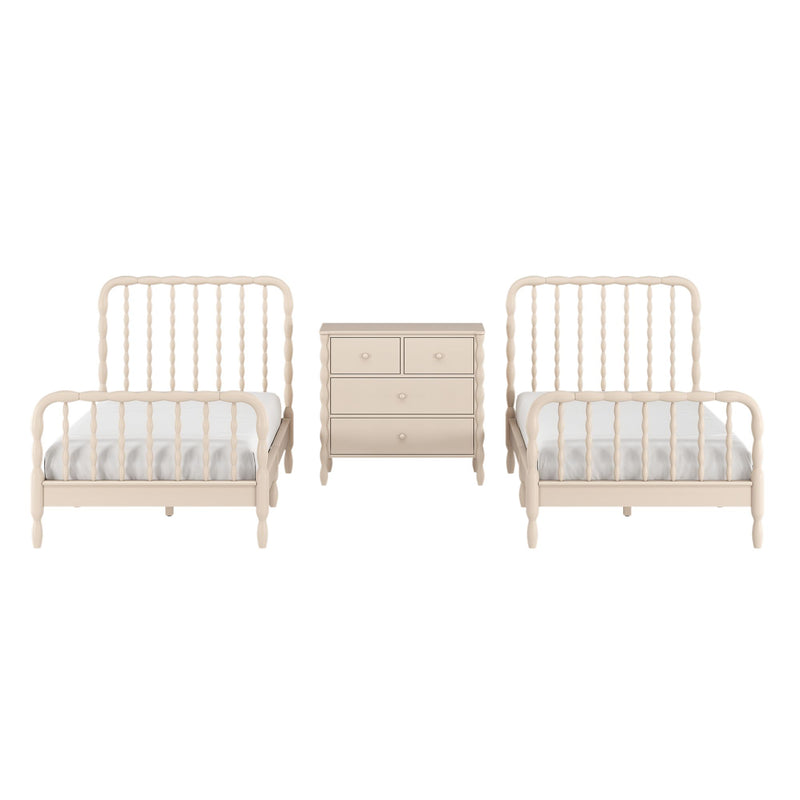 Neutral cream wooden twin beds with spindle headboards flanking a matching beige three-drawer dresser in a minimalist nursery or kids' bedroom