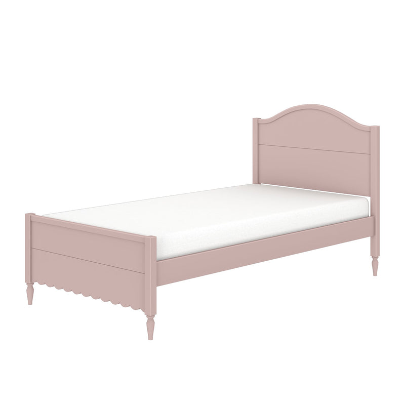 Pink wooden twin bed with arched headboard, white mattress, scalloped footboard and turned legs — kids bedroom furniture