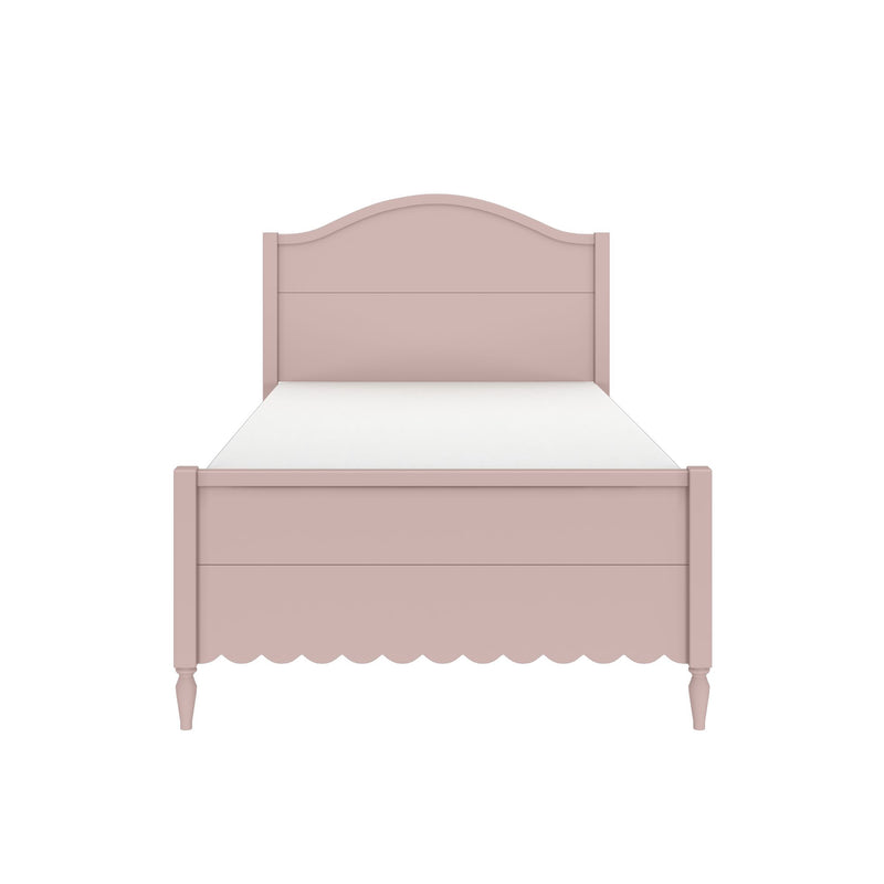 Pink arched headboard twin bed with scalloped apron and white mattress, vintage-style girls' bedroom furniture