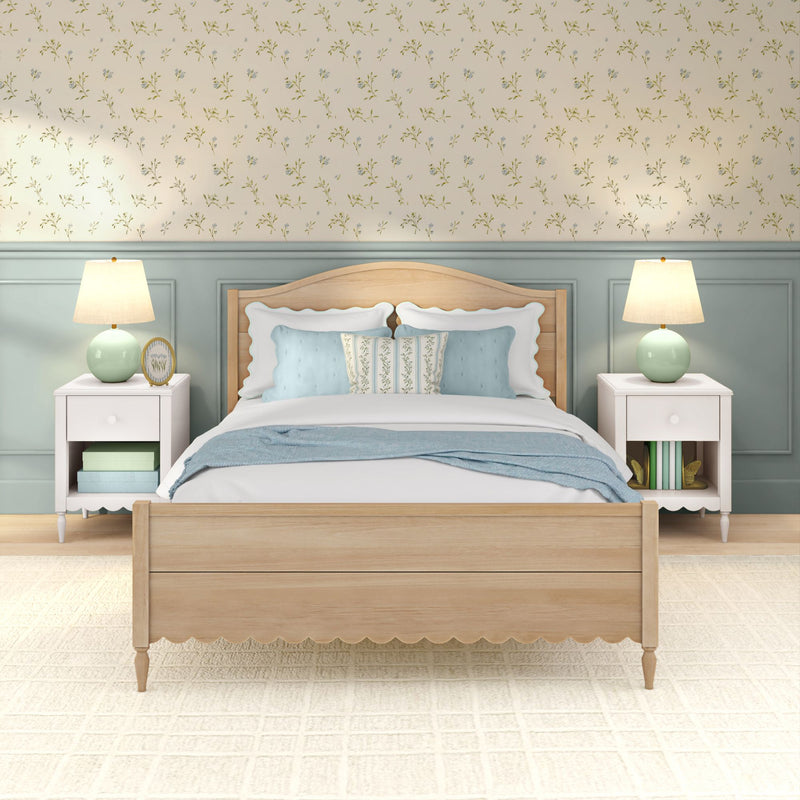 Cozy bedroom with light wood bed, soft blue bedding, floral wallpaper, mint bedside lamps and white nightstands