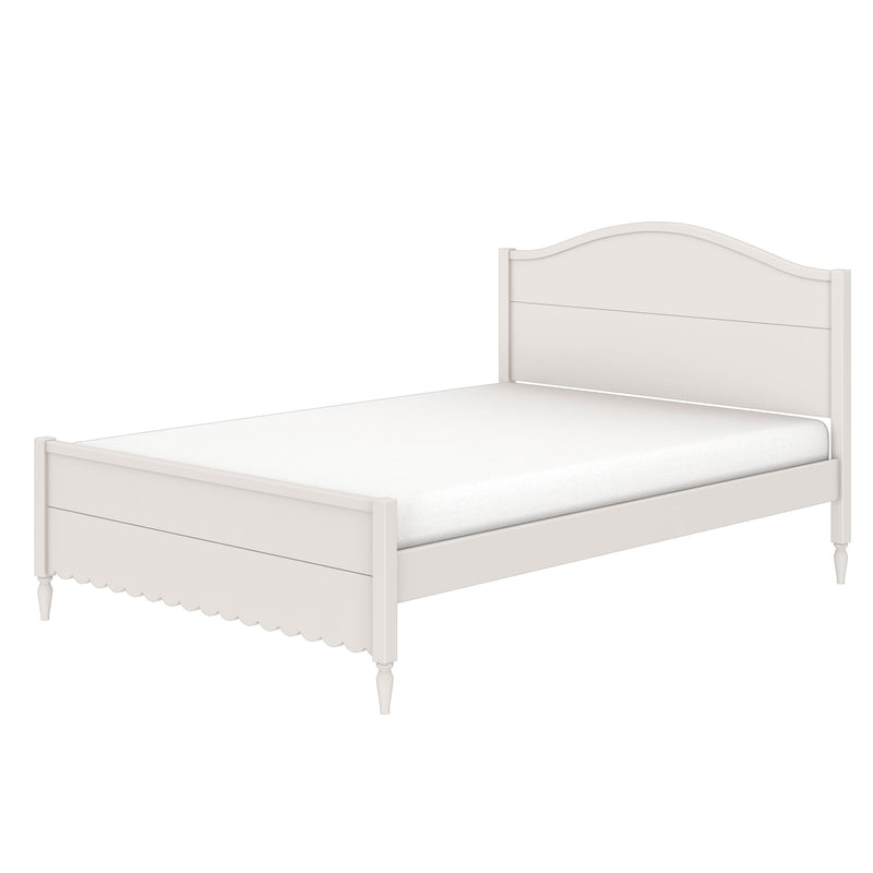 White twin wooden bed frame with arched headboard, scalloped footboard, turned legs and mattress, farmhouse-style bedroom furniture