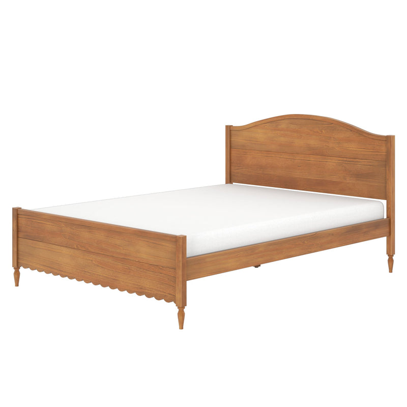 Solid wood bed frame with arched headboard and scalloped footboard on turned legs, natural oak finish and white mattress, isolated on white background