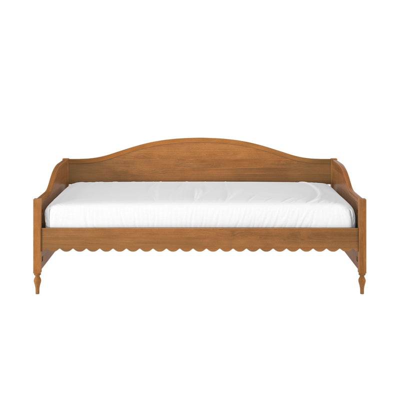 Wooden daybed frame with curved headboard and white mattress, rustic bedroom furniture isolated on white background
