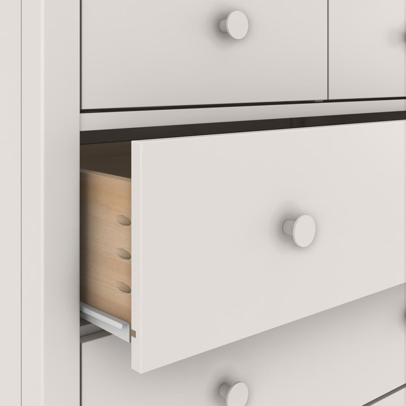 White wooden dresser with partially open drawer revealing dovetail joints and metal slide rail, round knobs, modern bedroom storage cabinet