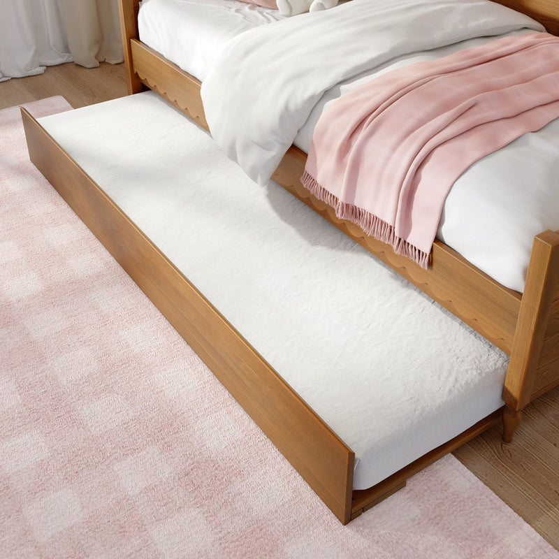 Wooden trundle bed with white bedding and blush pink throw blanket, pull-out mattress for space-saving bedroom solution