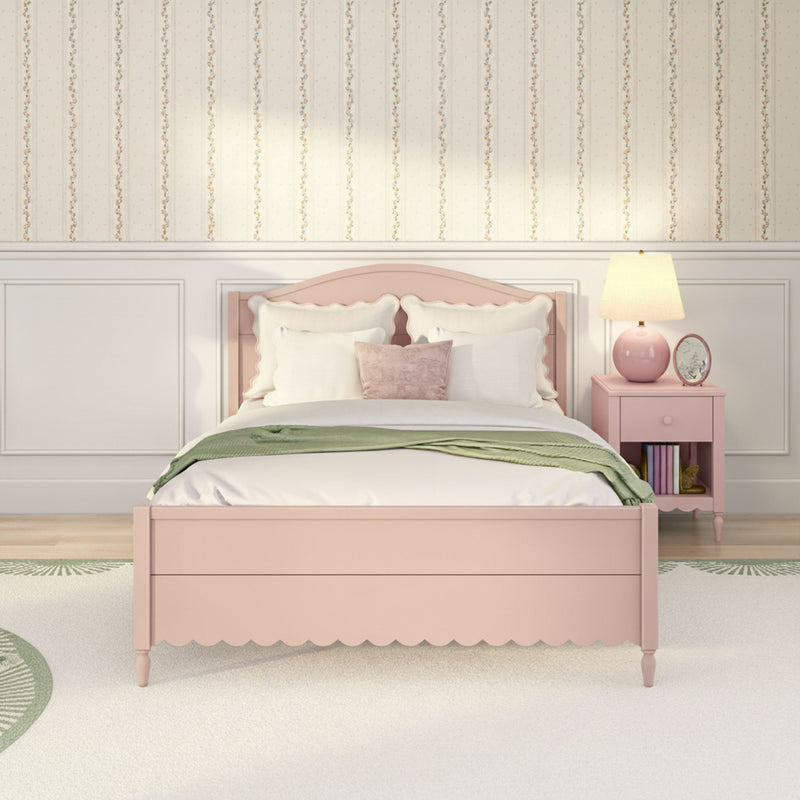 Pastel pink girls bedroom with scalloped headboard, white bedding and pillows, green throw, floral striped wallpaper and pink nightstand lamp