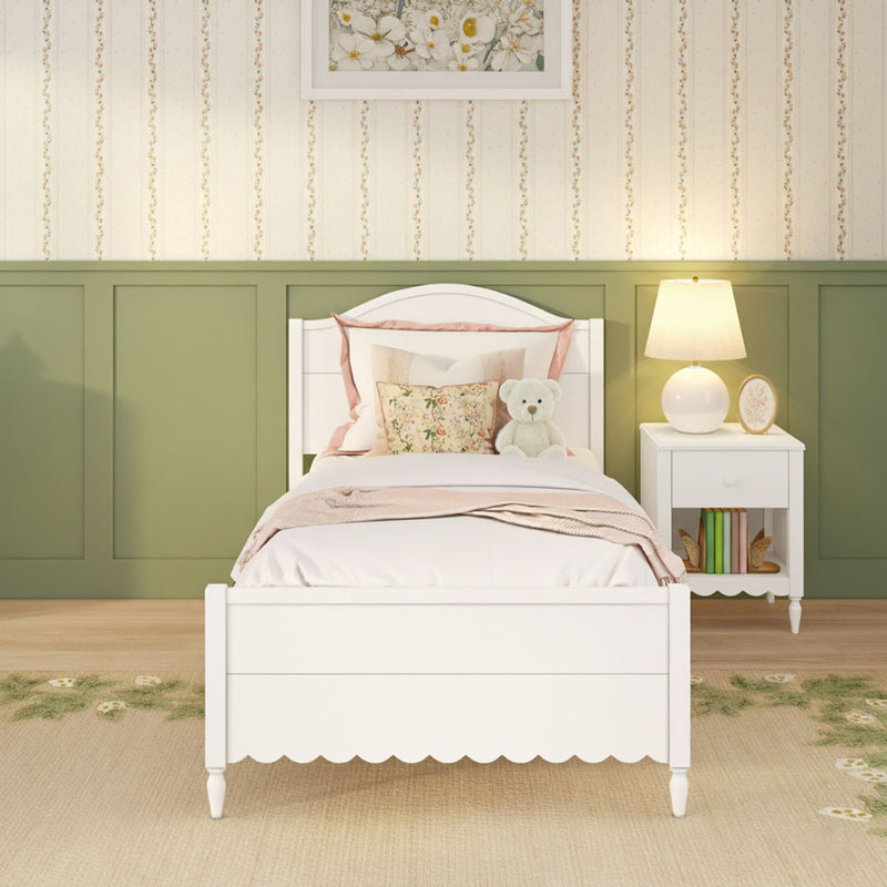Cozy kids' bedroom décor featuring a white wooden twin bed with floral pillows and teddy bear, green wainscoting, striped wallpaper and bedside lamp
