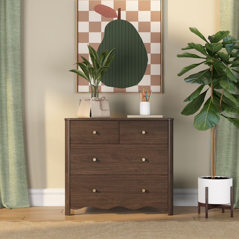 Modern entryway with dark wood dresser, abstract checkerboard pear wall art, potted fiddle leaf fig and tabletop plants, ceramic pencil holder and leather handbag