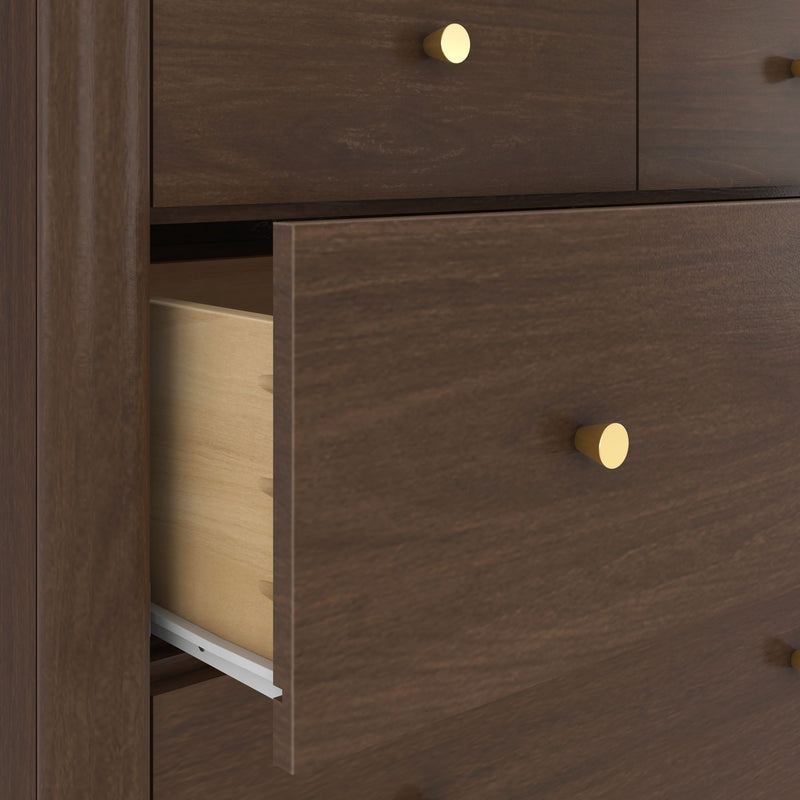 Close-up of dark wood dresser with partially open drawer, light wood interior, round brass knob and metal slide, modern bedroom storage
