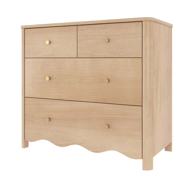 Light maple wood dresser with round brass knobs, scalloped base and visible wood grain — modern farmhouse bedroom chest of drawers for storage (close-up)
