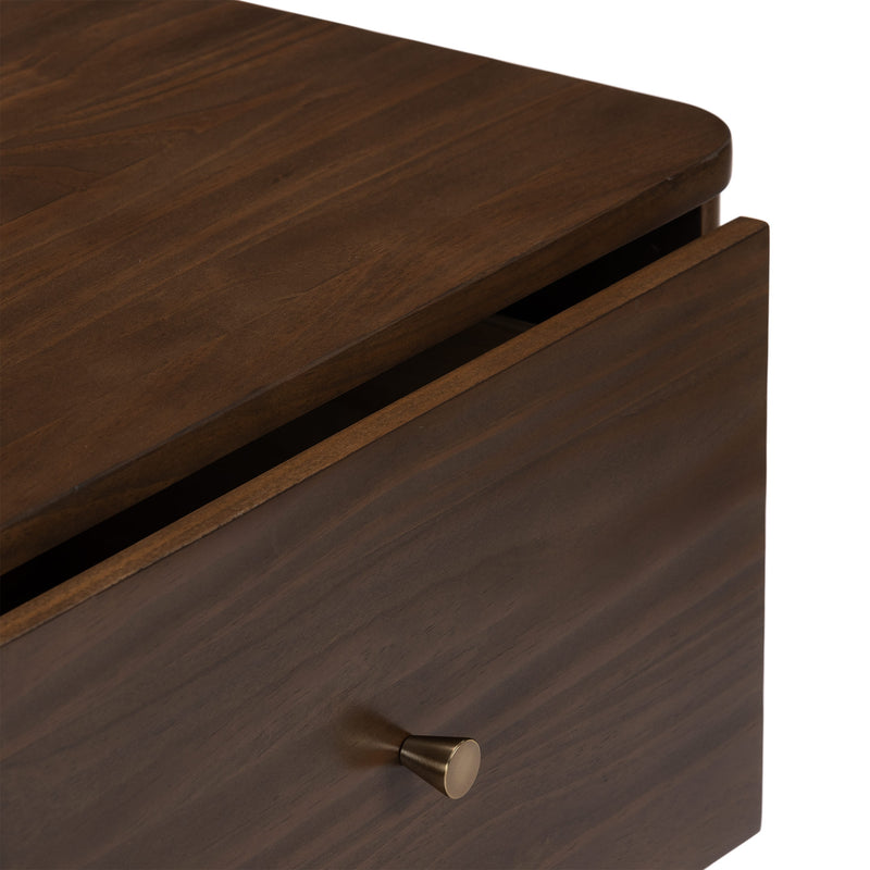 Close-up of walnut-finish wooden dresser drawer with rounded top edge and brass knob, dark brown modern nightstand detail