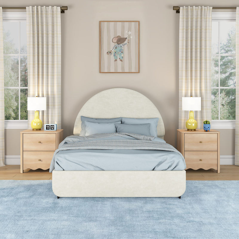 Modern kids bedroom with cream arched upholstered bed, light blue bedding, light wood nightstands, yellow bedside lamps, striped curtains, framed mouse wall art and plush blue area rug