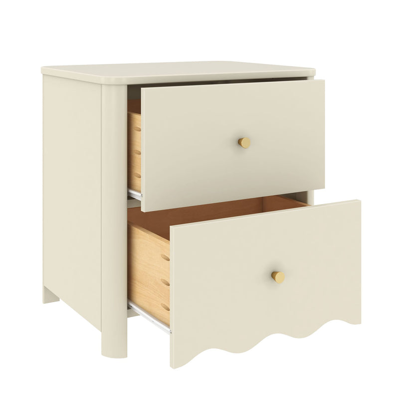 Cream two-drawer bedside nightstand with scalloped base and gold knobs, partially open drawers showing natural wood interiors — modern nursery or bedroom storage furniture