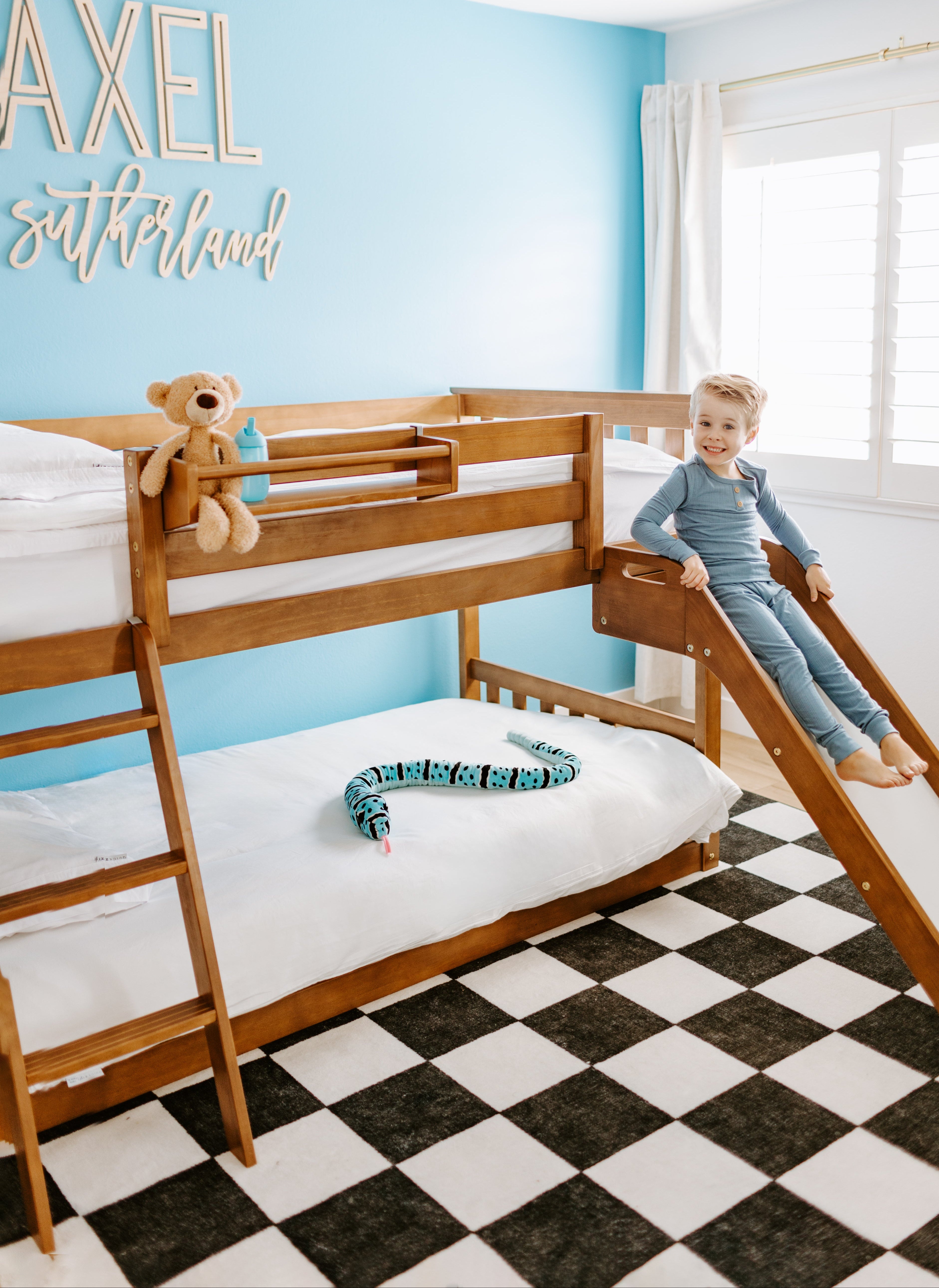 3 little girls playing on a white bunk bed