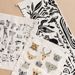 Illustrated animal alphabet wall art and graphics on fabric banners featuring various wildlife designs.