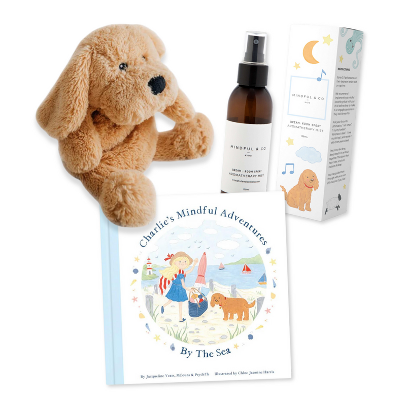Plush dog toy, aromatherapy mist, and "Charlie's Mindful Adventures by the Sea" children's book set.
