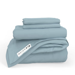 Blue Quick Zip bed sheets set with fitted and flat sheets neatly folded.
