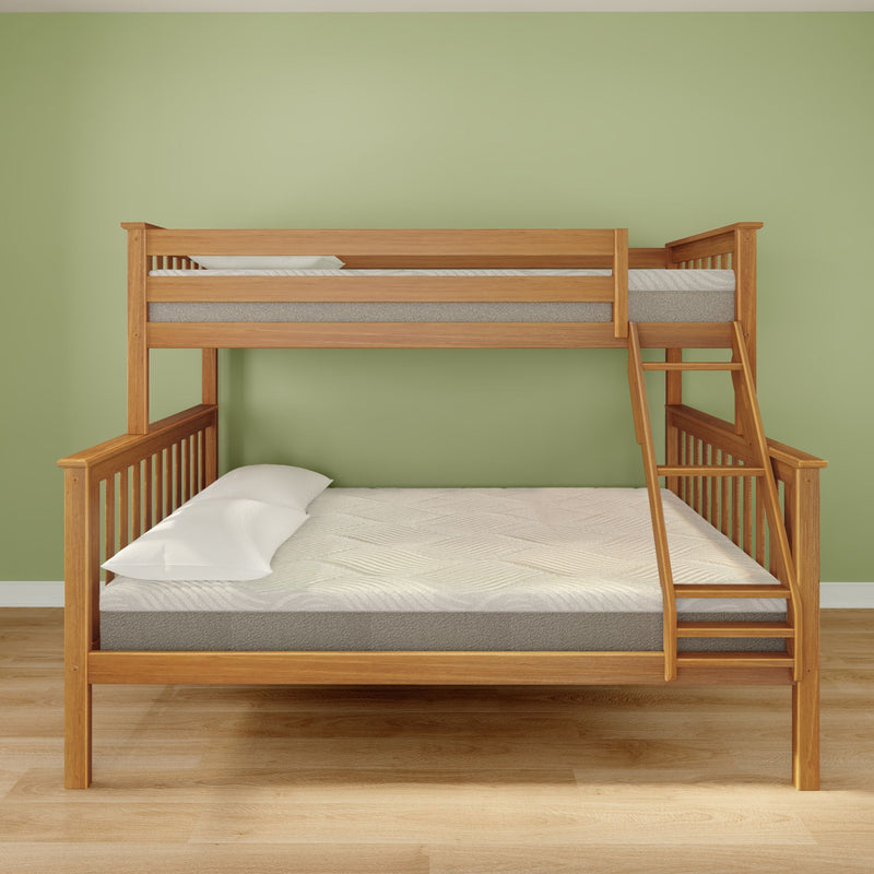 Twin-over-full wooden bunk bed with right-side ladder and natural oak finish, white pillows and mattresses against a sage green wall on hardwood floor