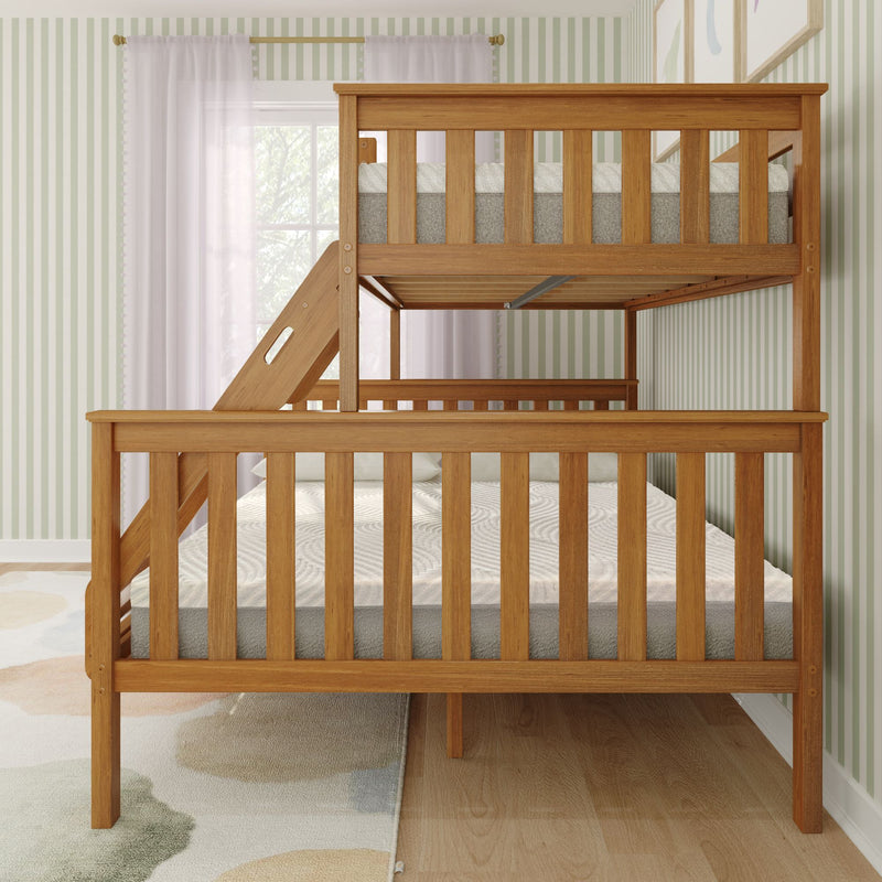 Natural oak solid wood twin-over-full bunk bed with slatted guardrails and angled ladder in bright children's bedroom with pale green striped wallpaper