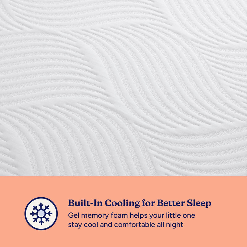 Close-up of quilted white baby crib mattress top with wave-pattern stitching and built-in cooling gel memory foam; peach banner with snowflake icon reads "Built-In Cooling for Better Sleep" — breathable, temperature-regulating infant mattress for improved comfort.