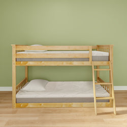 Wooden bunk bed with ladder against a light green wall in a cozy bedroom setting.