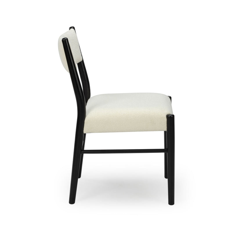 Side view of modern cream upholstered bar stool with black metal frame and curved backrest, contemporary kitchen counter stool
