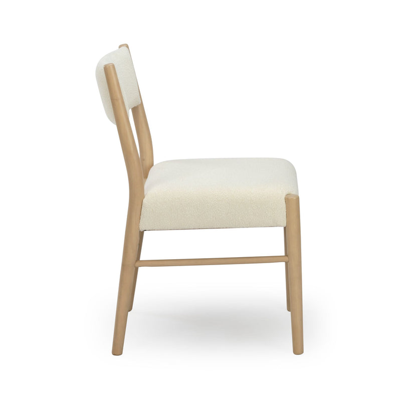 Side view of modern upholstered dining chair in cream boucle fabric with light natural wood frame and minimalist Scandinavian design