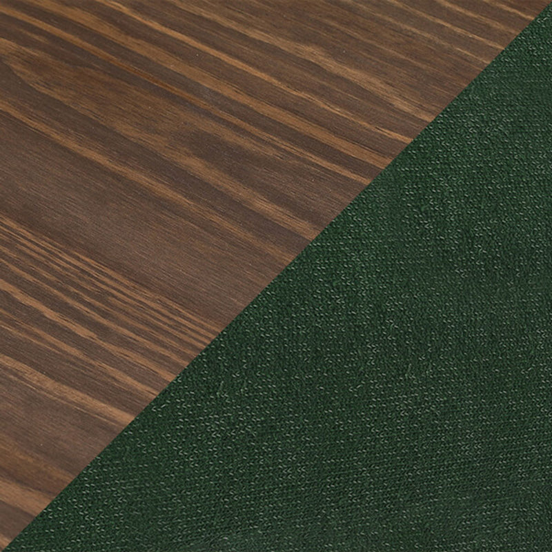 Diagonal close-up of dark walnut wood grain flooring paired with forest green textured carpet, flooring sample for interior design