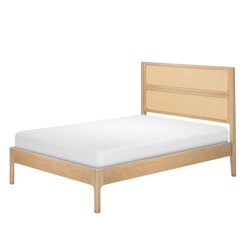 Light natural wood platform bed with woven rattan headboard and white mattress, modern boho bedroom furniture