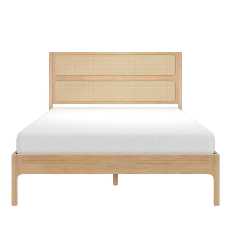 Natural oak platform bed with woven cane rattan headboard and white mattress, front view — minimalist boho bedroom furniture