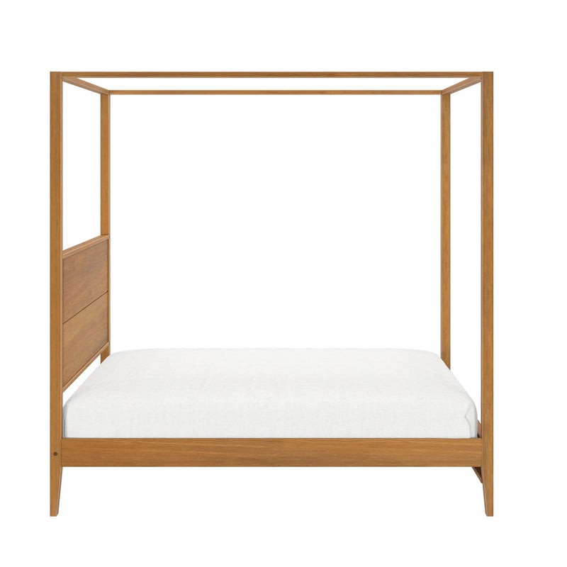 Four-poster wooden bed frame with white mattress showcasing minimalist bedroom furniture design.