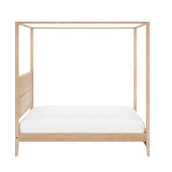 Oak wood minimalist four-poster bed frame with white mattress.