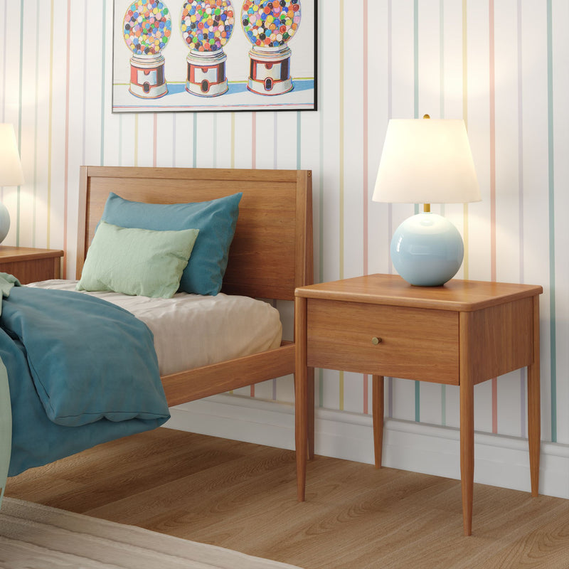 Mid-century modern bedroom with wooden bed frame and matching nightstand, teal and mint bedding, round blue bedside lamp, pastel striped wallpaper and colorful gumball artwork