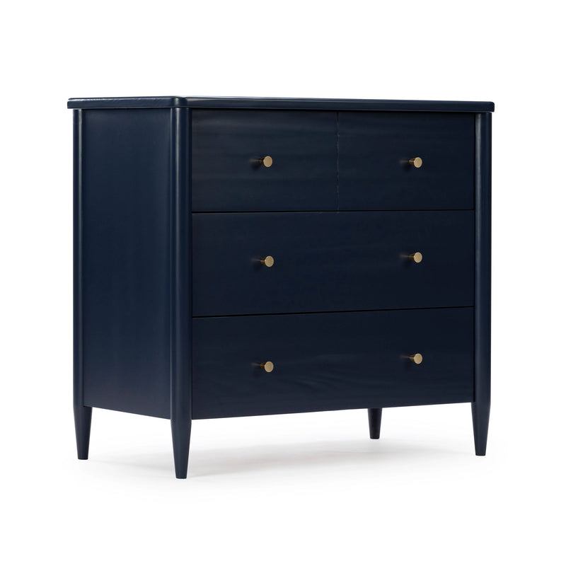 Navy blue mid-century modern dresser with tapered legs and round brass knobs, bedroom storage chest of drawers