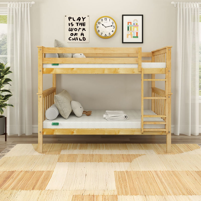 Natural pine twin-over-twin bunk bed with ladder in bright neutral children's bedroom, minimalist decor with mattresses, cushions and wall art