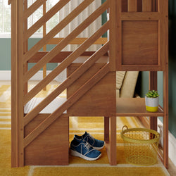 Space-saving wooden loft bed with angled slatted staircase and built-in cubby storage holding blue sneakers, yellow rug, and potted succulent in a modern kids' bedroom