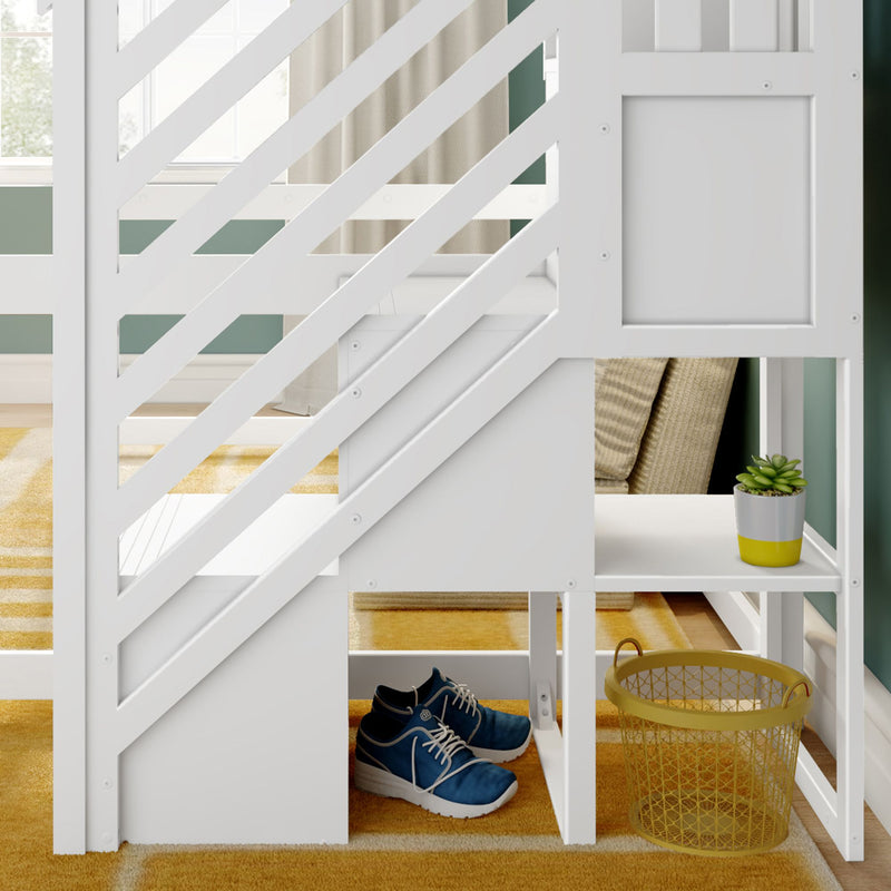 Modern white wooden loft bed with diagonal stair rails and built-in under-stair storage holding blue sneakers, yellow wire basket and potted succulent on mustard rug in green-walled kids' bedroom