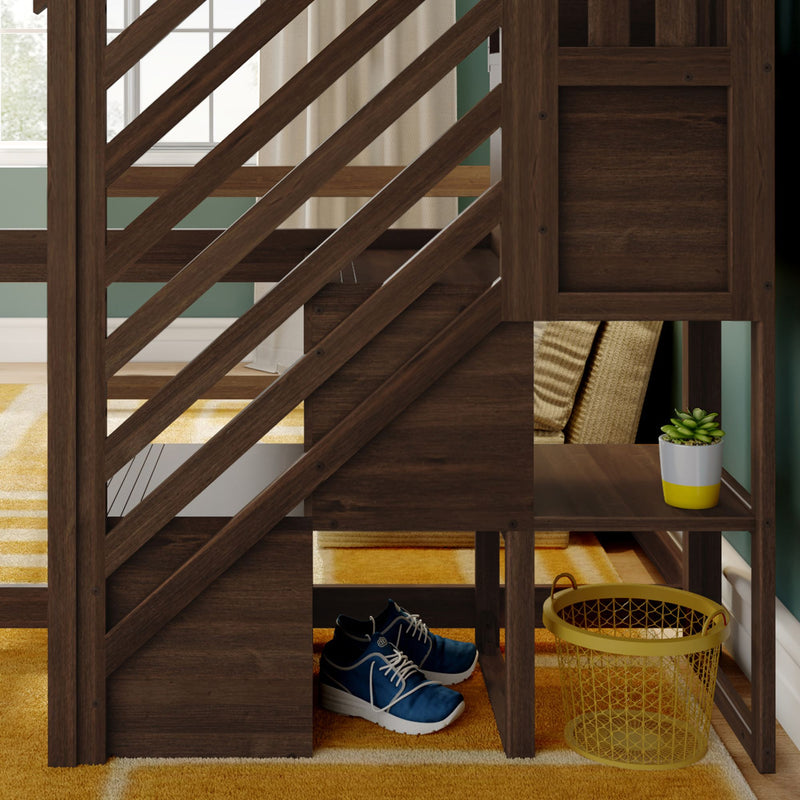 Wooden loft bed stairs with built-in cubby storage and diagonal railing, showing a potted succulent, folded pillows, blue sneakers and yellow wire basket on a mustard rug