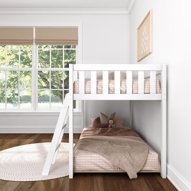 White kids bunk bed with beige gingham bedding and plush pillows in a bright nursery with large window and neutral decor