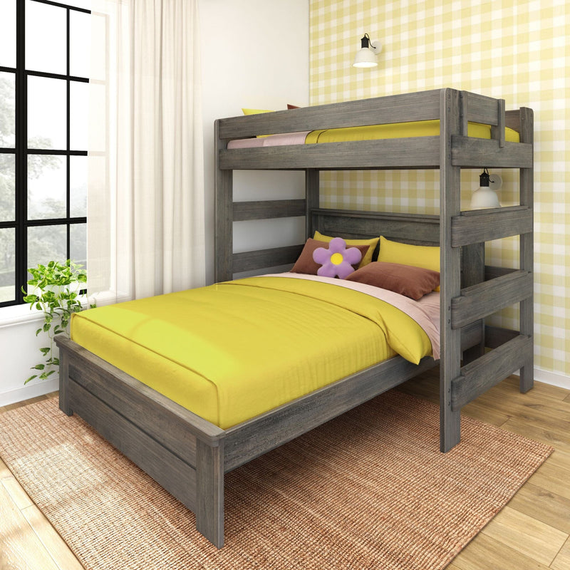 Gray wooden bunk bed with bright yellow bedding and flower pillow in a sunlit kids' bedroom with yellow plaid wallpaper.
