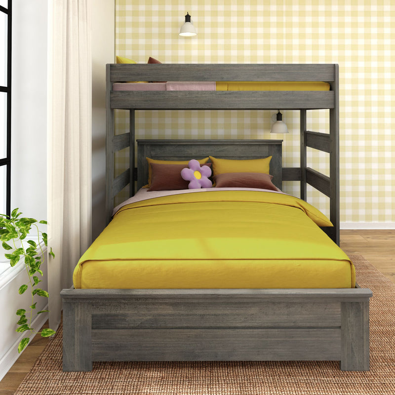 Modern grey wood bunk bed with yellow bedding in a stylish bedroom with plaid wallpaper and plant accents.