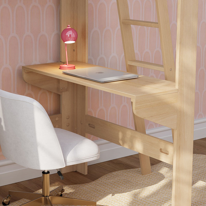Small home office with light wood wall desk, silver laptop, pink desk lamp and white swivel chair against pink wallpaper