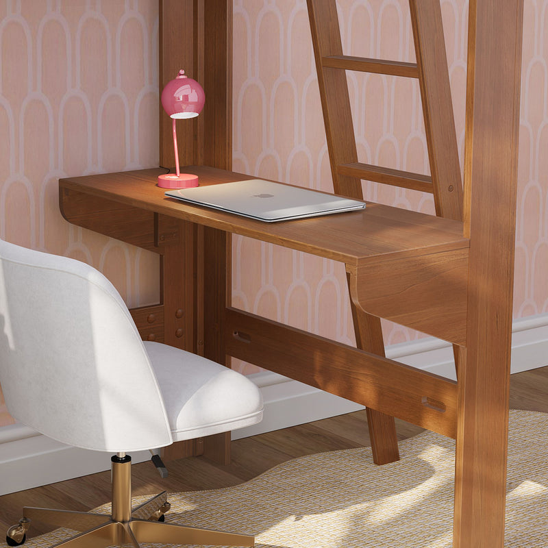 Modern home office workspace with a wooden wall-mounted desk, closed silver laptop, pink desk lamp and white swivel chair against pastel patterned wallpaper