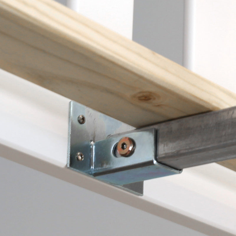 Galvanized metal L-bracket securing a wooden beam to a steel channel for garage shelf support, screws visible